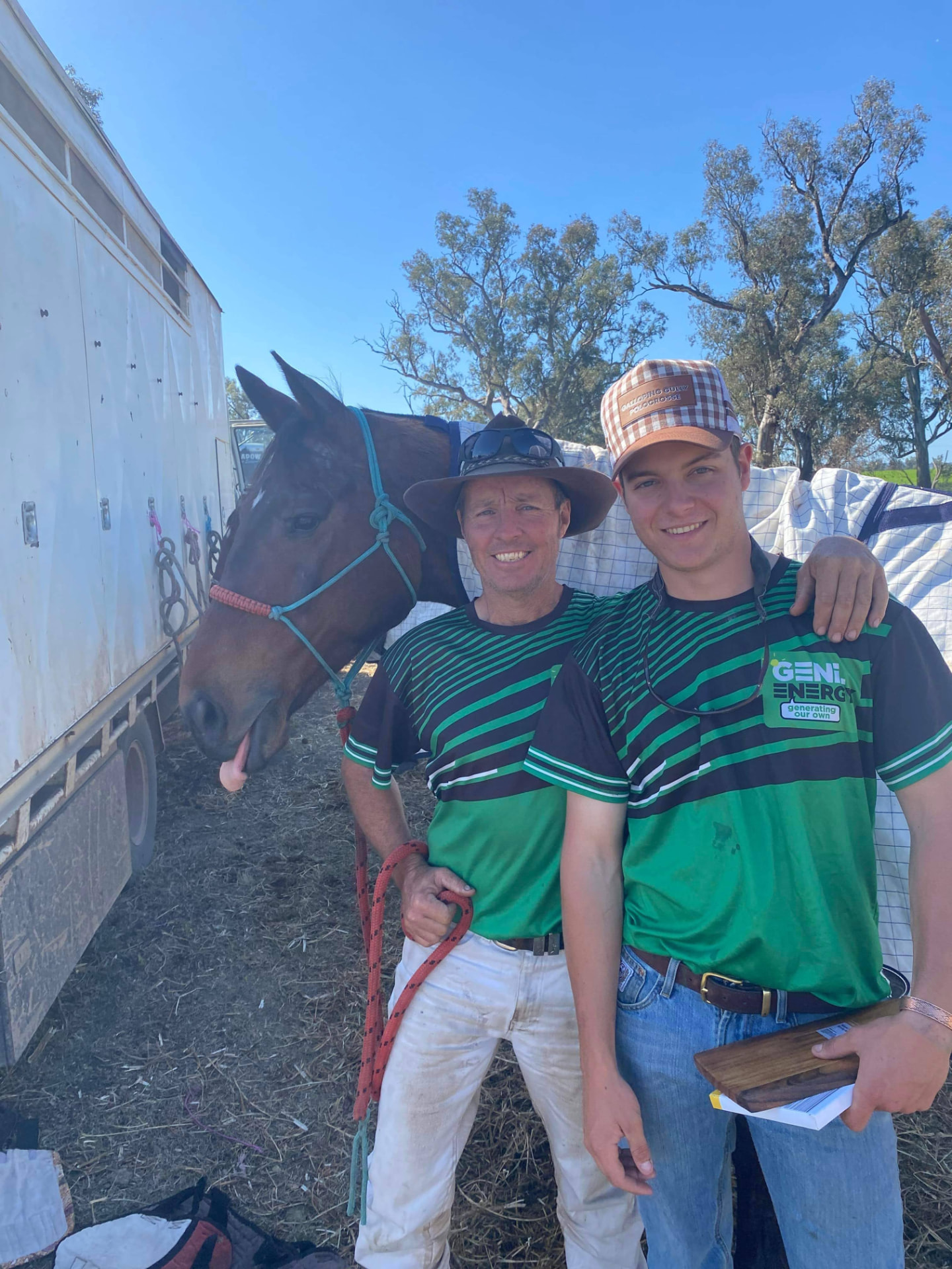 Hugh and Geoff Hunter standing with their horse, ready for a day's mustering